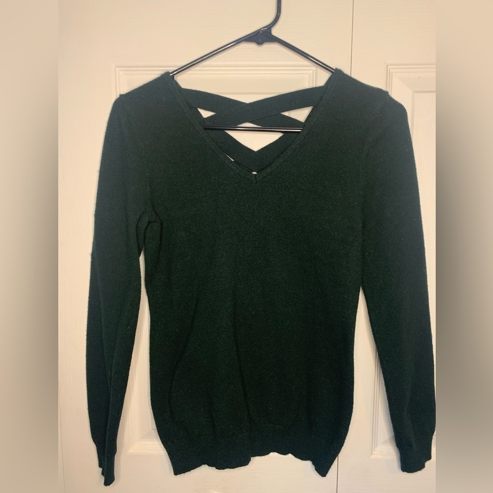 Woman’s Love Ellie sweater with crisscross design, dark green, xs.